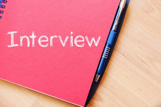 Interview text concept write on notebook
