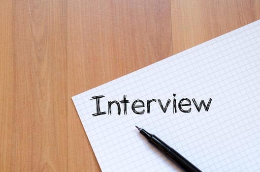 Interview text concept write on notebook