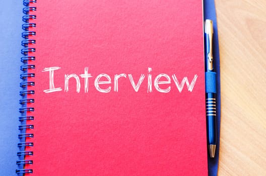 Interview text concept write on notebook