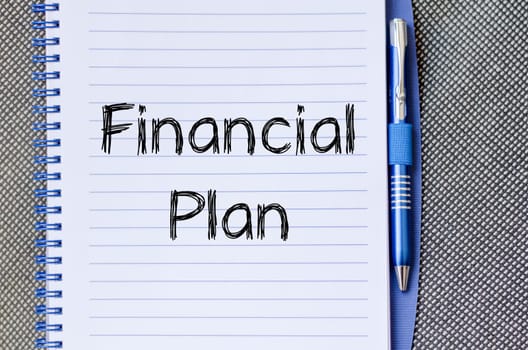 Financial plan text concept write on notebook