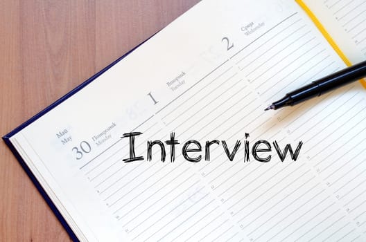 Interview text concept write on notebook