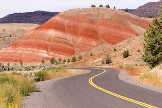 The road winds through colorful mineral and rock deposits in Oregon