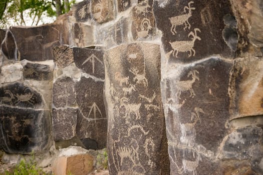 Primitive rock drawings hundreds of years old we call Petroglyphs
