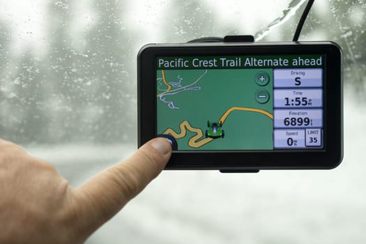 A driver picks a route on his mobile GPS