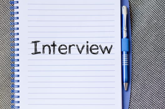 Interview text concept write on notebook