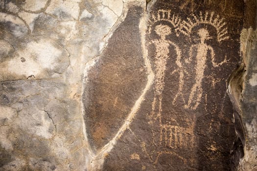 Primitive rock drawings hundreds of years old we call Petroglyphs