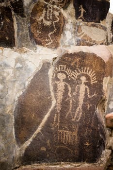 Primitive rock drawings hundreds of years old we call Petroglyphs
