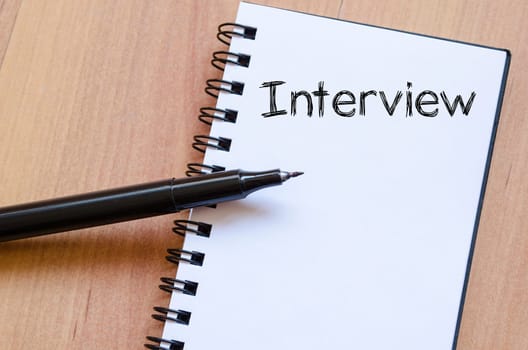Interview text concept write on notebook