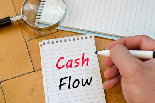 Cash flow text concept write on notebook