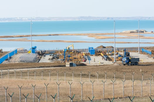 Taman, Russia - November 5, 2016: Construction of a bridge across the Kerch Strait, the infrastructure facility at the shoreline of the Taman peninsula, as of November 2016
