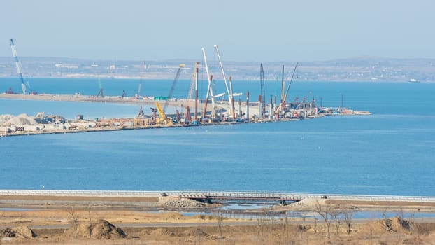Taman, Russia - November 5, 2016: Construction of a bridge across the Kerch Strait, the views of the Tuzla Spit from the Taman Peninsula, as of November 2016