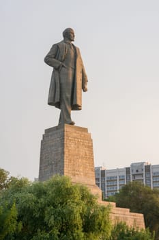Volgograd, Russia - August 1, 2016: View of the sunset on the statue of Lenin on the waterfront in the Krasnoarmeysk district of Volgograd