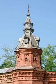 Sergiev Posad - August 10, 2015: the tower on the red wall extending from retail shops around Pafnutevskom garden at the Trinity-Sergius Lavra