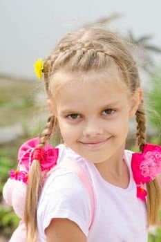 Portrait of a beautiful six year old girl with blond hair