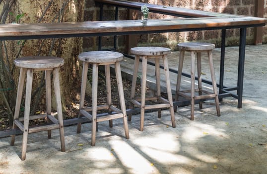 Outdoor wooden tables and chairs, stock photo