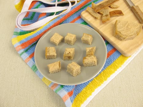 Bread cubes with sausage as finger food for toddlers