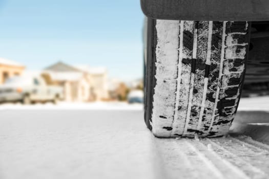 Car tire on snowy winter road
