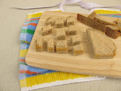 Bread cubes with sausage as finger food for toddlers