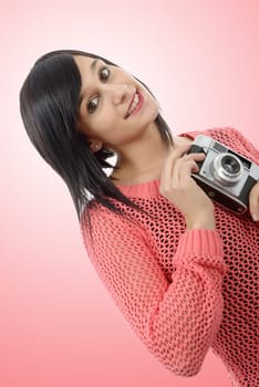 pretty young brunette woman with an antique camera