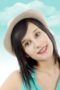 pretty young brunette woman with a summer hat