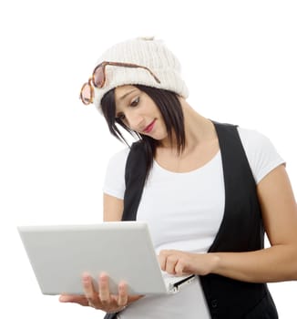 young brunette girl with a laptop isolated on white background