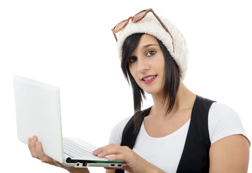 young brunette girl with a laptop isolated on white background
