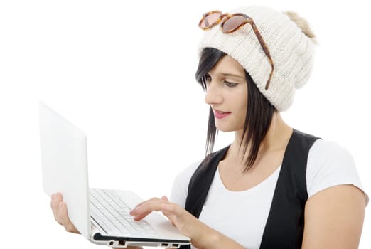 young brunette girl with a laptop isolated on white background