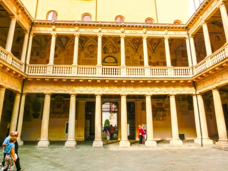Padua, Italy - September 19, 2014: Tourists walking and viewing Palazzo Bo, historical building home of the Padova University from 1539, in Padua, Italy