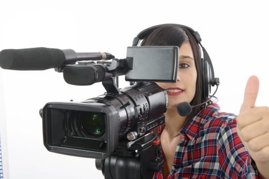 pretty young brunette girl with a professional camcorder, isolated on white background