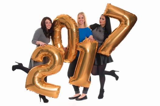 Three women hold golden numbers for New Year's Eve - New Year's Eve 2017