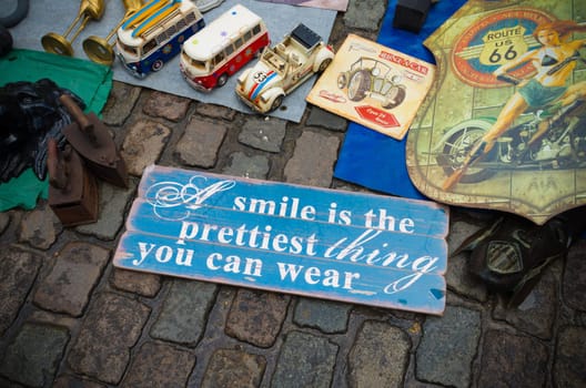 signboard with text: smile is the prettiest thing you can wear