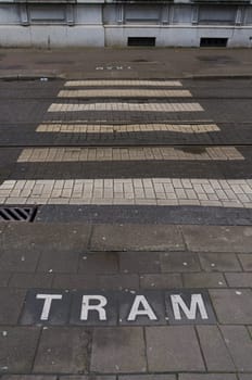 pedestrian crossing with tram warning in the center of antwerp, belgium