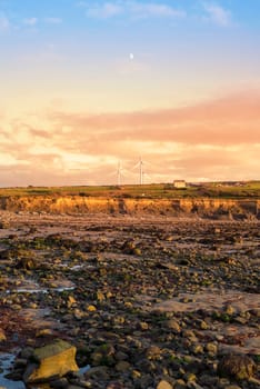 rocky beal beach near ballybunion on the wild atlantic way ireland with a beautiful yellow sunset