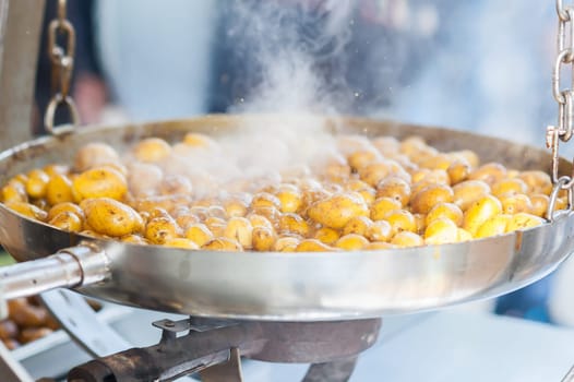 New potatoes. Fried in a pan. Italian recipe: potatoes cooked to Salento. Selective focus.