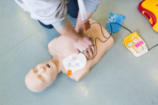 First aid cardiopulmonary resuscitation course using automated external defibrillator device, AED.