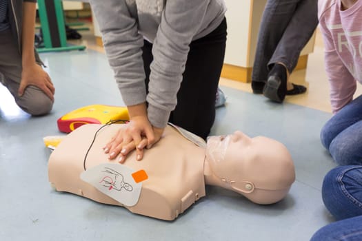 First aid cardiopulmonary resuscitation course using automated external defibrillator device, AED.