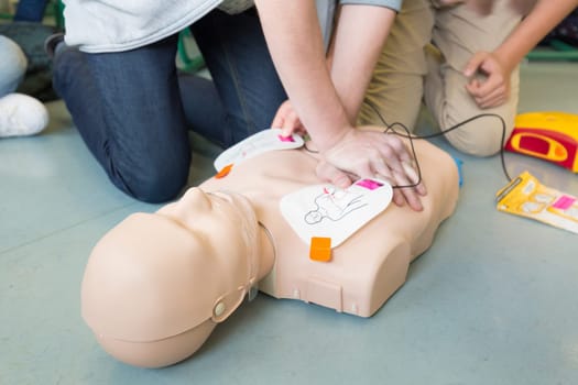 First aid cardiopulmonary resuscitation course using automated external defibrillator device, AED.