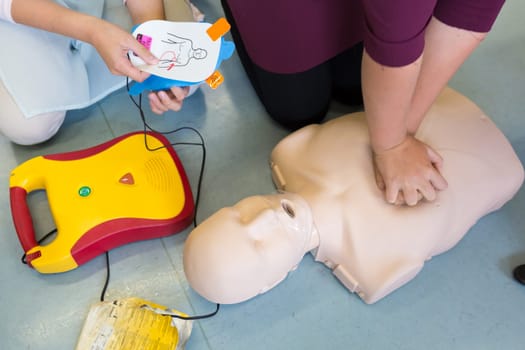 First aid cardiopulmonary resuscitation course using automated external defibrillator device, AED.