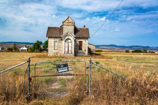 No trespassing sign in front of an old abandoned house in Ovid, Idaho