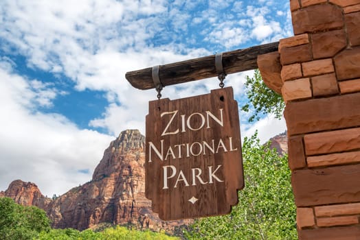 Sign marking the entrance to Zion National Park in Springdale, Utah