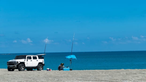 New Taipei City, Taiwan - 26 October : the man enjoin fishing on the beach with nice weather in New Taipei City, Taiwan