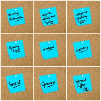 Collage of Business Acronyms written on blue paper note pinned on cork board with white thumbtack, copy space available