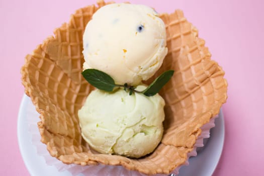 Homemade ice cream scoops in waffle bowl, stock photo