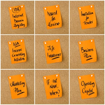 Collage of Business Acronyms written on orange paper note pinned on cork board with white thumbtack, copy space available