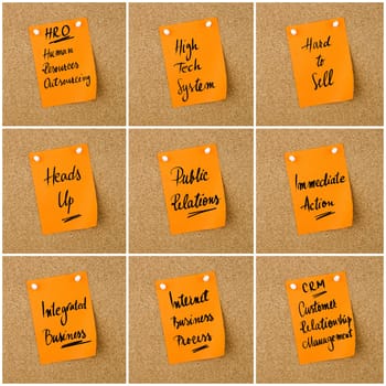 Collage of Business Acronyms written on orange paper note pinned on cork board with white thumbtack, copy space available