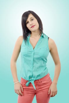 young brunette girl with a green shirt and pink pants