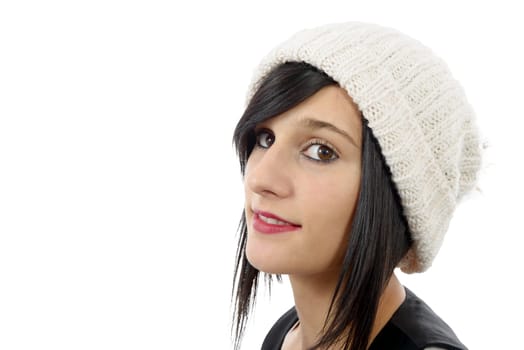 portrait of a pretty young brunette with winter hat isolated on white background