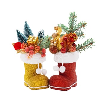 Red and golden boots of Santa Claus with Christmas decorations isolated