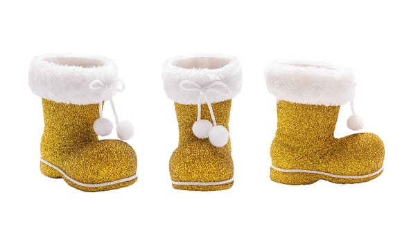 Set of empty golden boots of Santa Claus isolated