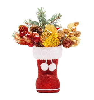Red boots of Santa Claus with Christmas decorations isolated